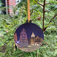 Load image into Gallery viewer, These beautiful Notre Dame Ornaments highlight Christmas Tree scenes from Notre Dame. The ornaments are 3 1/4" in diameter and feature beautiful full color stylized photos, imprinted on birch wood.
