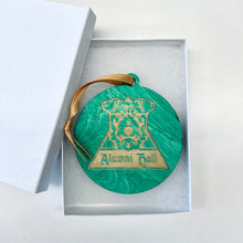Load image into Gallery viewer, This Alumni Hall Christmas Ornament is made from stained birch, laser-engraved, and is 3.25" in diameter.