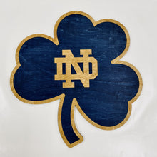 Load image into Gallery viewer, This Premium Notre Dame Monogram on Blue Shamrock Wall Art is currently available in three sizes: Small (12"), Medium (18") and Large (30").