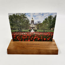 Load image into Gallery viewer, The photo (6" x 8") is printed on aluminum and sits in a cherry wood base (9" long) which is engraved with the University of Notre Dame seal and your student or graduate's name and class year!