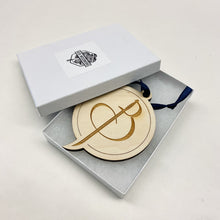 Load image into Gallery viewer, This Baumer Hall Christmas Ornament is made from un-stained birch, laser-engraved, and is 3.25" in diameter.