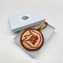 Load image into Gallery viewer, This ornament is made from red-stained birch, is laser-engraved, and is 3.25" in diameter.