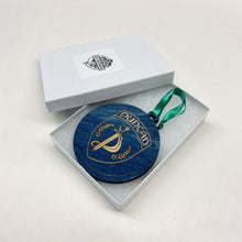 Load image into Gallery viewer, This Duncan Hall Christmas Ornament is made from blue stained birch, laser-engraved, and is 3.25" in diameter.