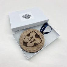 Load image into Gallery viewer, This Morrissey Manor Christmas Ornament is made from unstained walnut, laser-engraved, and is 3.25" in diameter.