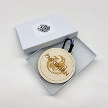 Load image into Gallery viewer, This Pangborn Hall Christmas Ornament is made from unstained birch, laser-engraved, and is 3.25" in diameter.