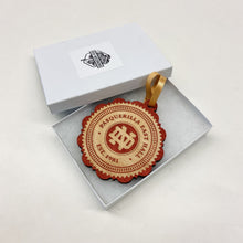 Load image into Gallery viewer, This Pasquerilla East Hall Christmas Ornament is made from stained birch, laser-engraved, and is 3.25" in diameter.