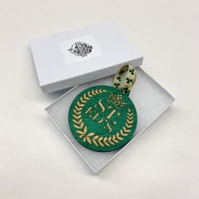 Load image into Gallery viewer, This St. Edward's Hall Christmas Ornament is made from stained birch, laser-engraved, and is 3.25" in diameter.