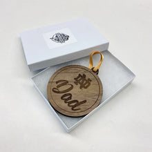 Load image into Gallery viewer, Let’s be honest, parents love to show their ND pride with these types of gifts. This particular ornament is made from solid walnut wood, because that is what dad would want.