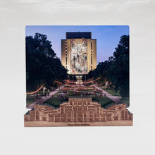 Load image into Gallery viewer, The included 8" x 10" photo is printed on aluminum and highlights the view of Hesburgh Library across the quad from the Stadium. The stand is engraved with "Notre Dame Stadium" and measures 10" x 2 1/2" x 1 1/2".