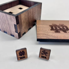 Load image into Gallery viewer, The pair of cufflinks are engraved with a Notre Dame monogram on one and the ND Leprechaun on the other, along with your Notre Dame graduate's initials. The cufflinks themselves are solid sterling silver and are of the highest quality. Cufflinks measure 5/8" square.