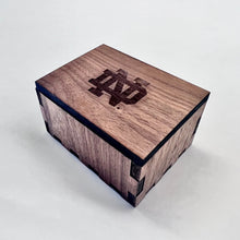 Load image into Gallery viewer, The pair of cufflinks are engraved with a Notre Dame monogram on one and the ND Leprechaun on the other, along with your Notre Dame graduate's initials. The cufflinks themselves are solid sterling silver and are of the highest quality. Cufflinks measure 5/8" square.