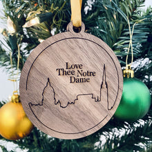 Load image into Gallery viewer, Let’s be honest, parents love to show their ND pride with these types of gifts. This particular ornament is made from solid walnut wood, because that is what dad would want.