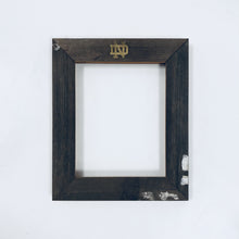 Load image into Gallery viewer, These frames are available in landscape or portrait, are engraved with a "gold-leaf" Notre Dame Monogram above and your message or personalization can be added below. Glass and backing are included.