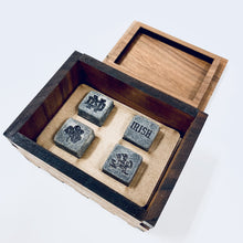 Load image into Gallery viewer, The engraved Notre Dame Whiskey Stones are presented in a laser-cut, handmade box, crafted from walnut wood and engraved with the ND Monogram. The stones are .75" square and the box measures 4" x 3" x 2.25".