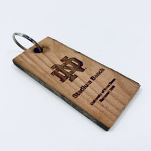 Load image into Gallery viewer, Our Notre Dame Stadium Bench Wood Keychain measures 1.25" x 3.3" x .25".