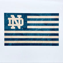 Load image into Gallery viewer, This beautiful wall art is crafted from a single piece of Notre Dame-blue stained wood, engraved by a laser to reveal the golden color of the natural wood underneath and measures 28" x 16.5".