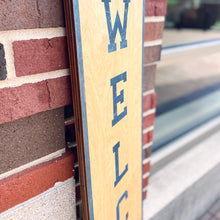 Load image into Gallery viewer, This Notre Dame "Welcome" Porch Leaner  is carefully crafted from THREE layers of 1/4" birch, making it extremely sturdy and built to last. Measuring 46" x 10" x 3/4", this Notre Dame Porch Leaner will be clearly visible to all who enter!