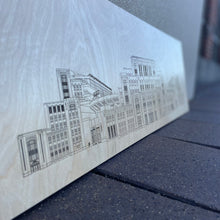 Load image into Gallery viewer, This beautiful Notre Dame Stadium linework is crafted from golden, UV-prefinished 1/2" plywood and features an incredibly detailed linework of Notre Dame Stadium. It measures 28" x 9" and comes with attached hardware.