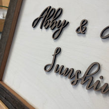 Load image into Gallery viewer, This custom Bride and Groom Sign with Stadium Wood Frame measures 19" x 14" and will be crafted from white-stained birch, natural walnut, and Notre Dame Stadium Bench wood!