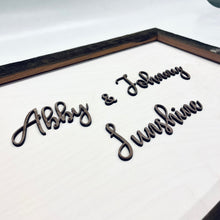 Load image into Gallery viewer, This custom Bride and Groom Sign with Stadium Wood Frame measures 19" x 14" and will be crafted from white-stained birch, natural walnut, and Notre Dame Stadium Bench wood!