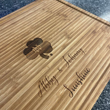 Load image into Gallery viewer, This premium cutting board is made from bamboo and measures 15.75" x 11.75" x .75".