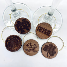 Load image into Gallery viewer, These 5-charm set is laser-cut from Notre Dame Stadium Bench Wood.