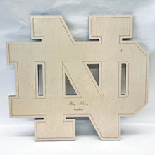 Load image into Gallery viewer, This beautiful Notre Dame Monogram Guest "Book" is crafted from golden, UV-prefinished 1/2" plywood and features a lasered pin-stripe outline. Our Notre Dame Monogram Guest "Book" measures 30" x 30".