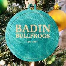 Load image into Gallery viewer, This Badin Hall Christmas Ornament is made from green stained birch, laser-engraved, and is 3.25" in diameter.