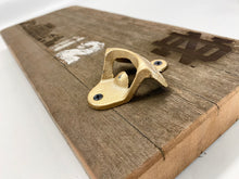 Load image into Gallery viewer, Our Notre Dame Stadium Bench Wood Bottle Opener is crafted from a full 16-inch stretch of stadium bench.