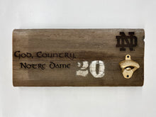 Load image into Gallery viewer, Our Notre Dame Stadium Bench Wood Bottle Opener is crafted from a full 16-inch stretch of stadium bench.