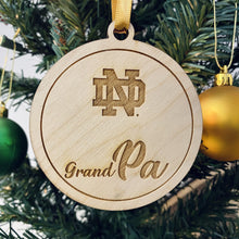 Load image into Gallery viewer, Each ornament in this Notre Dame Grandma & Grandpa Christmas Ornament Set is made from birch, laser-engraved, and 3.25" in diameter.