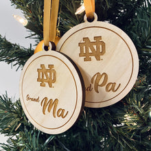 Load image into Gallery viewer, Each ornament in this Notre Dame Grandma & Grandpa Christmas Ornament Set is made from birch, laser-engraved, and 3.25" in diameter.