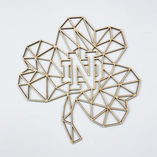 Load image into Gallery viewer, This Geometric Notre Dame Shamrock Wall art measures 24" x 24" x 1/4" and is laser cut from unstained birch.