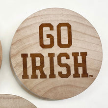 Load image into Gallery viewer, This Notre Dame Bottle Opener Set features three 2 1/2&quot; round wooden openers.
