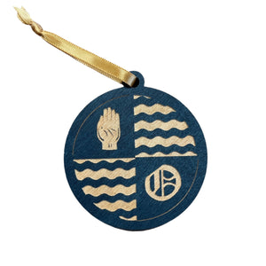 This O'Neill Hall Christmas Ornament is made from blue- stained birch, laser-engraved, and is 3.25" in diameter.