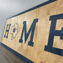 Load image into Gallery viewer, Our 24&quot; x 9&quot; x 1/2&quot; Premium Notre Dame HOME Horizontal Sign comes in two color ways: Gold on Blue
