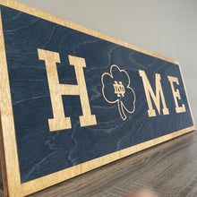 Load image into Gallery viewer, Our 24&quot; x 9&quot; x 1/2&quot; Premium Notre Dame HOME Horizontal Sign comes in two color ways: Blue on Gold
