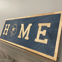 Load image into Gallery viewer, Our 24&quot; x 9&quot; x 1/2&quot; Premium Notre Dame HOME Horizontal Sign comes in two color ways: Blue on Gold
