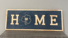 Load image into Gallery viewer, Our 24&quot; x 9&quot; x 1/2&quot; Premium Notre Dame HOME Horizontal Sign comes in two color ways: Blue on Gold
