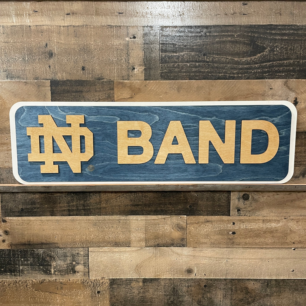 Wooden sign with 'ND Band' on a wooden background