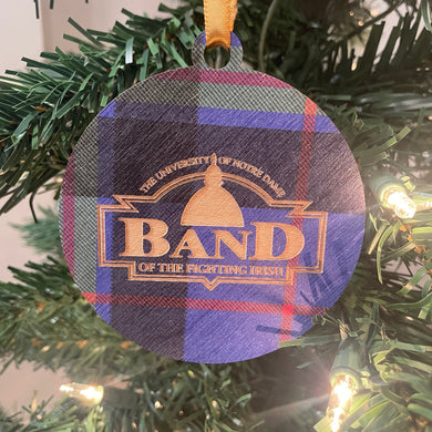 Plaid ornament with 'Band of the Fighting Irish' text on a Christmas tree.