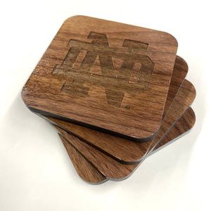 This Notre Dame Coaster Set is crafted from walnut hard wood, and portrays the most iconic of ND logos: The Monogram, The Shamrock, the Leprechaun, and the block IRISH. Each coaster measures 3.5" x 3.5". 