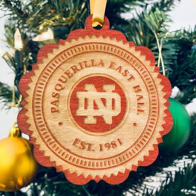 This Pasquerilla East Hall Christmas Ornament is made from stained birch, laser-engraved, and is 3.25